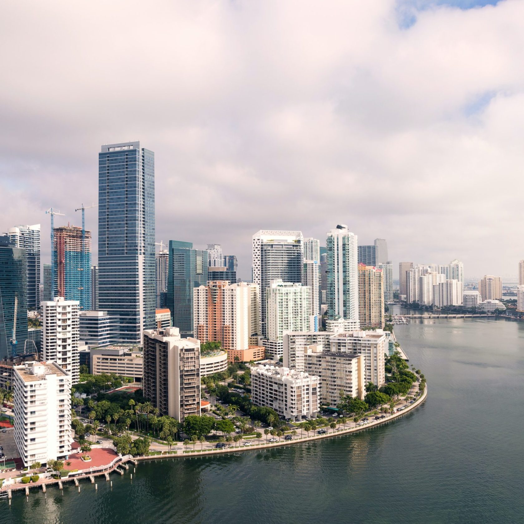 a large body of water with a city in the background