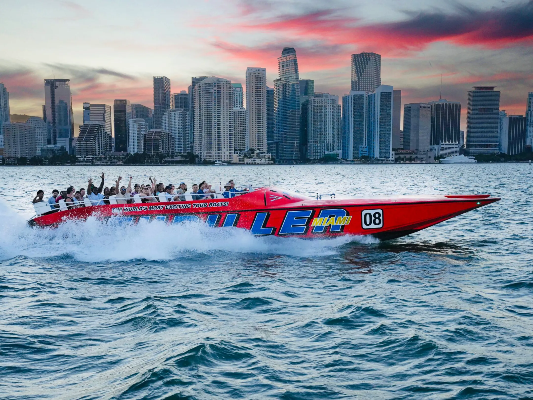a large body of water with a city in the background