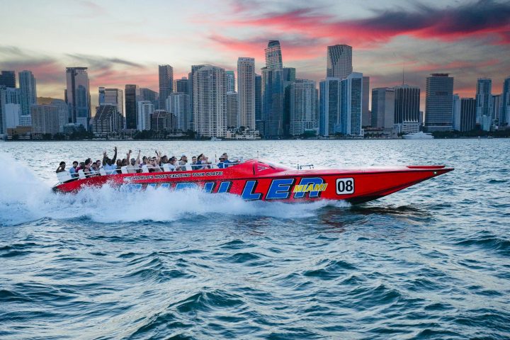 a large body of water with a city in the background