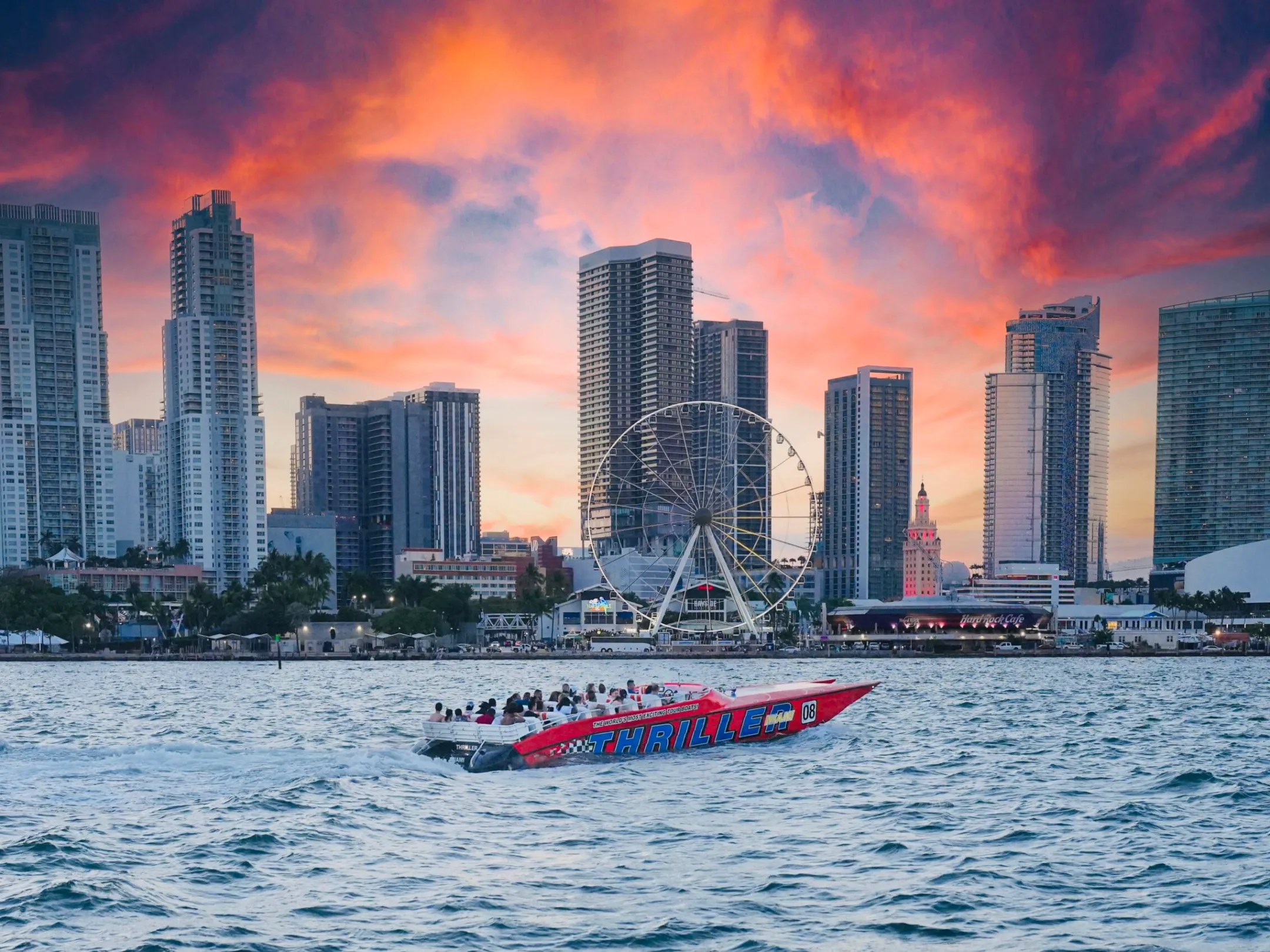 a large body of water with a city in the background