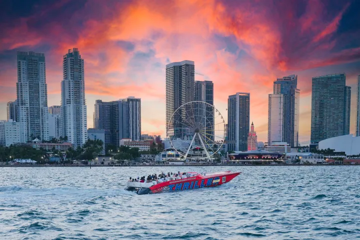a large body of water with a city in the background