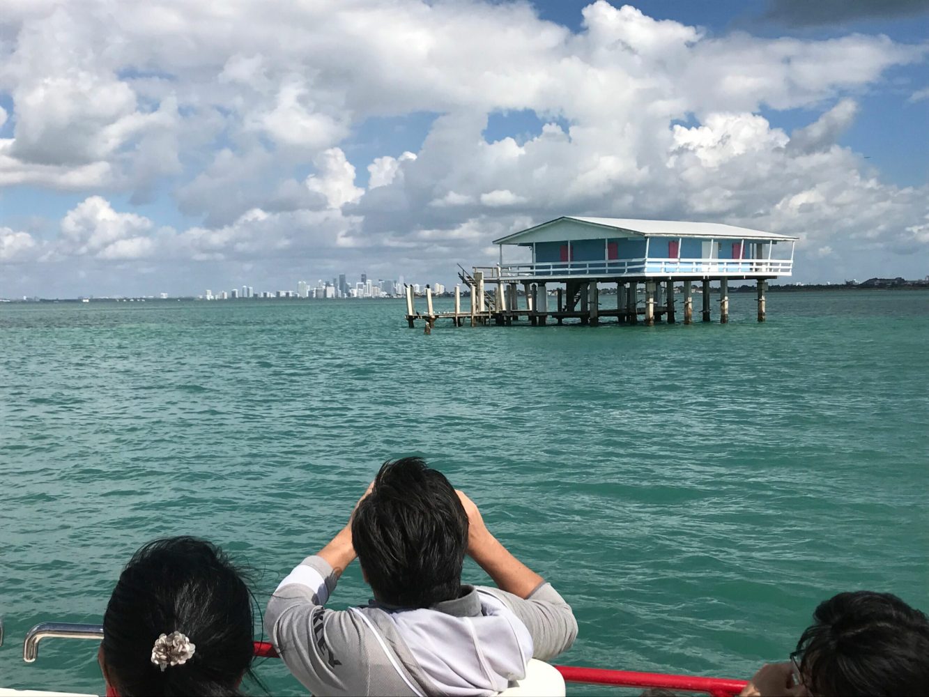 a group of people in a boat on a body of water