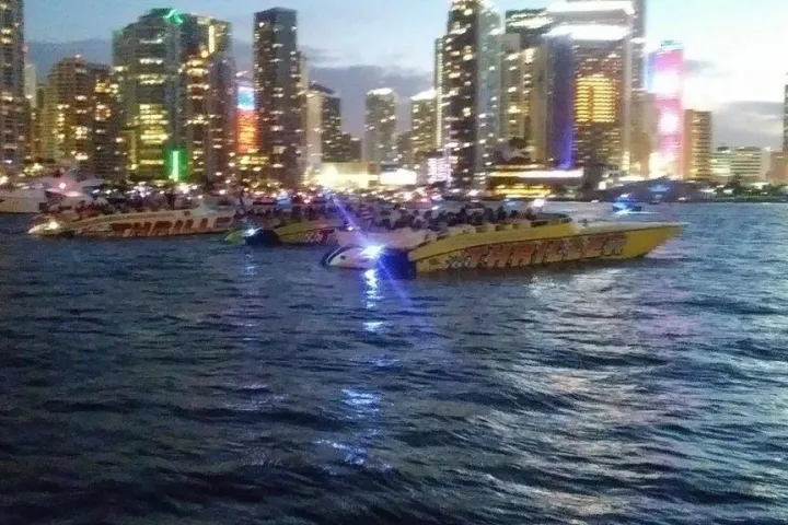 a large body of water with a city in the background