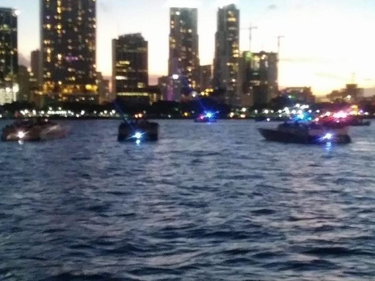a large body of water with a city in the background